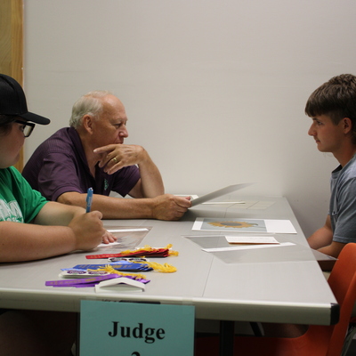 Getting feedback and learning from a judge at the Geary County Free Fair.