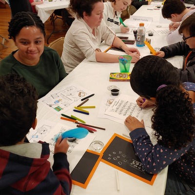 Hands on History participants learned the art of penmanship and practiced writing with a quill