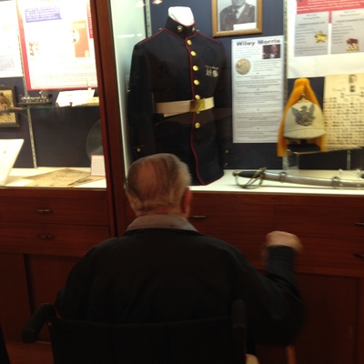 Clarence Erichsen visits his brother-in-law's Marine uniform on display at the Museum, 2020