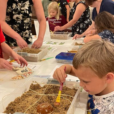 STEAM Saturday, families explore archaeological principles and unearth Geary County artifacts