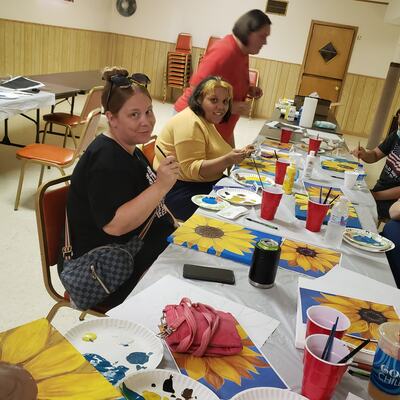 Having fun together at one of JCAC's paint parties!