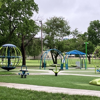 Swings and additional play equipment at Playground park