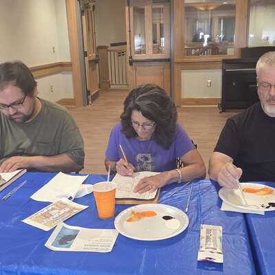 A family of painters enjoying time together at one of our acrylic painting classes.