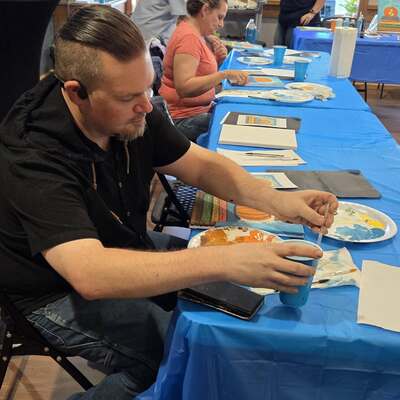 Artists working hard at an acrylic painting class.